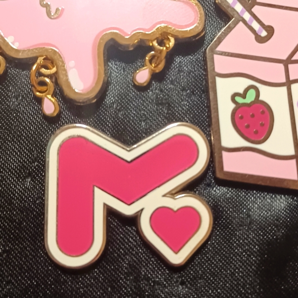 Meg Turney Logo Enamel Pin